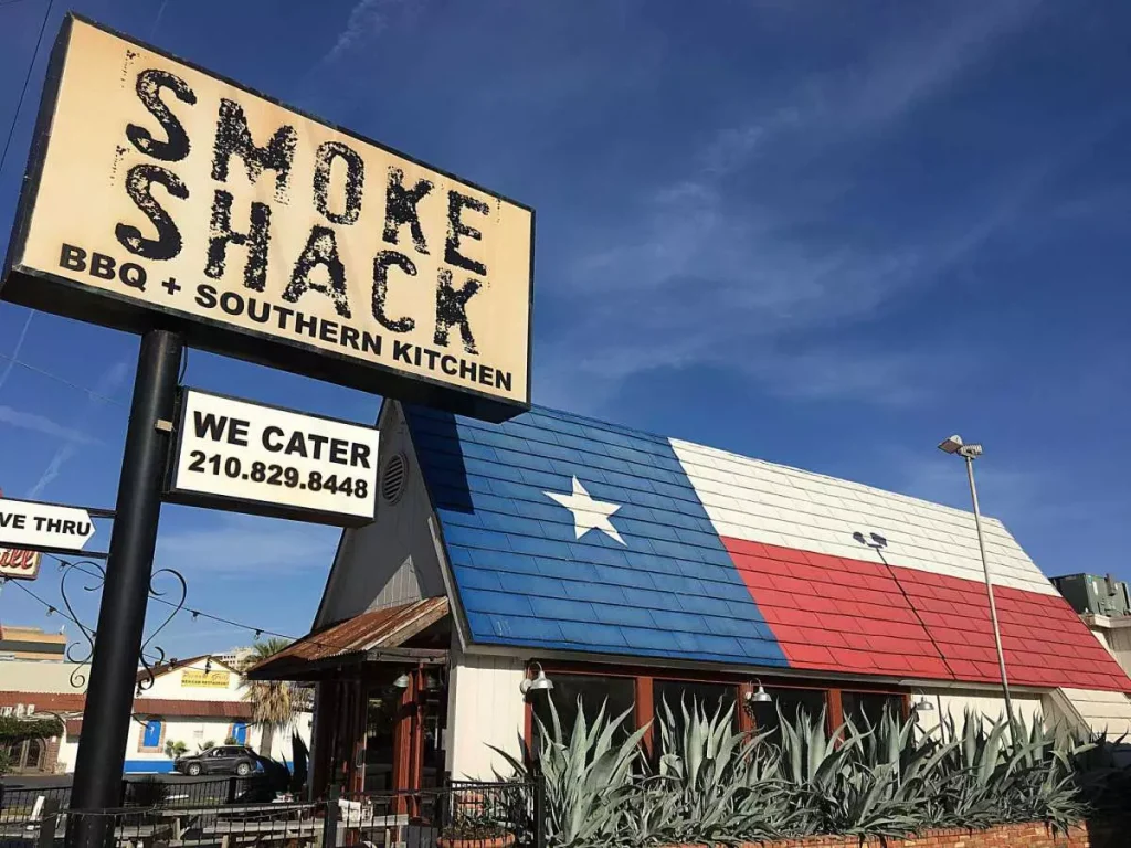 Smoke Shack BBQ, Texas BBQ object with the texas flag printed on it and a sign next to it that prints its name