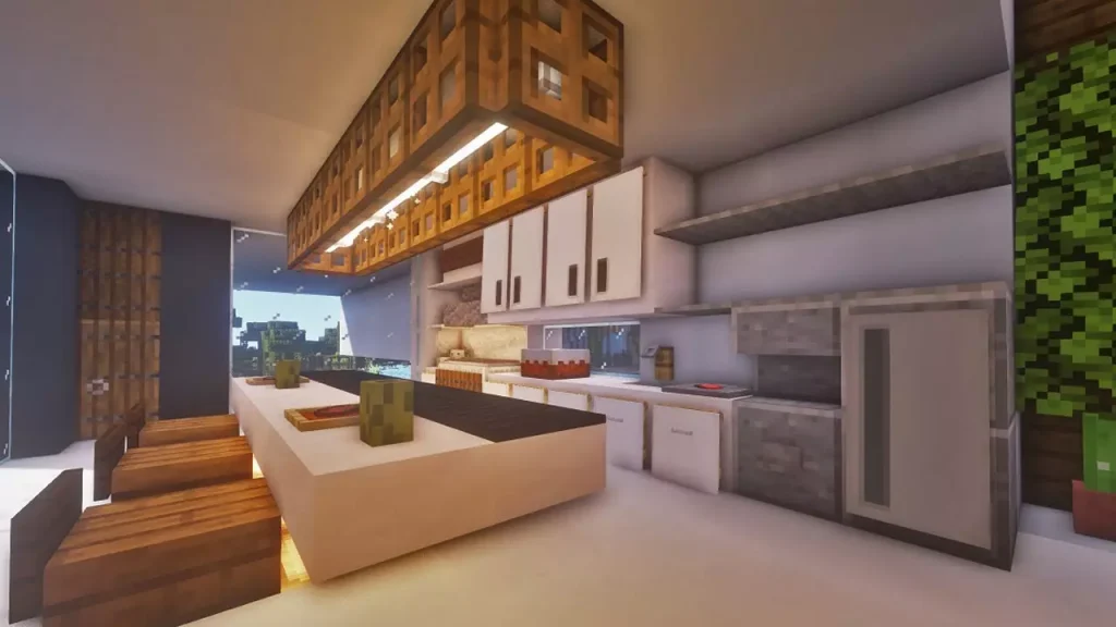 A kitchen with a fridge, seating and a sink