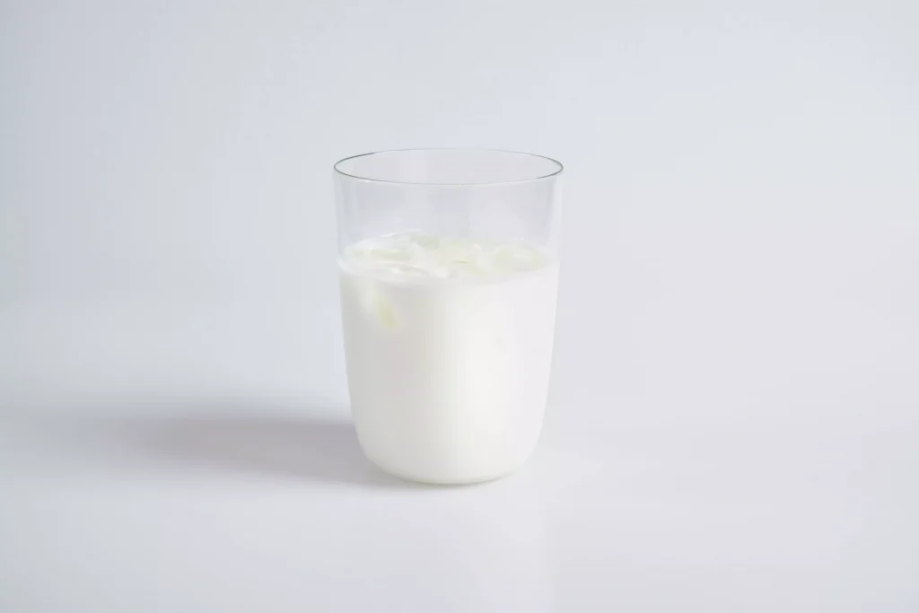 A glass of milk half full