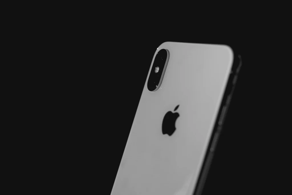 Iphone X, with a black background