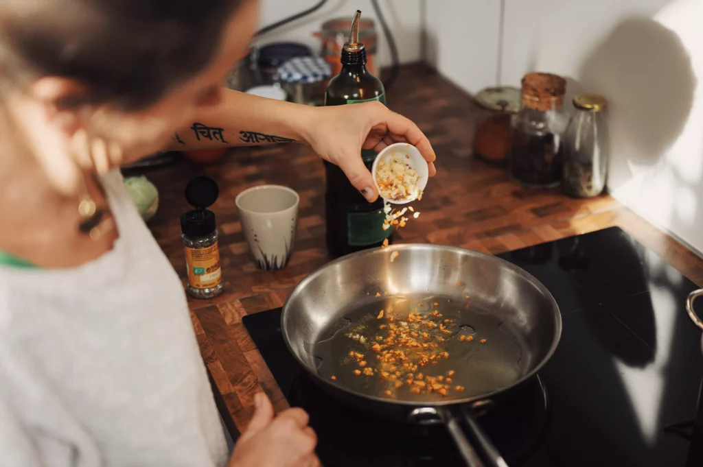 A man cooking something in a pan