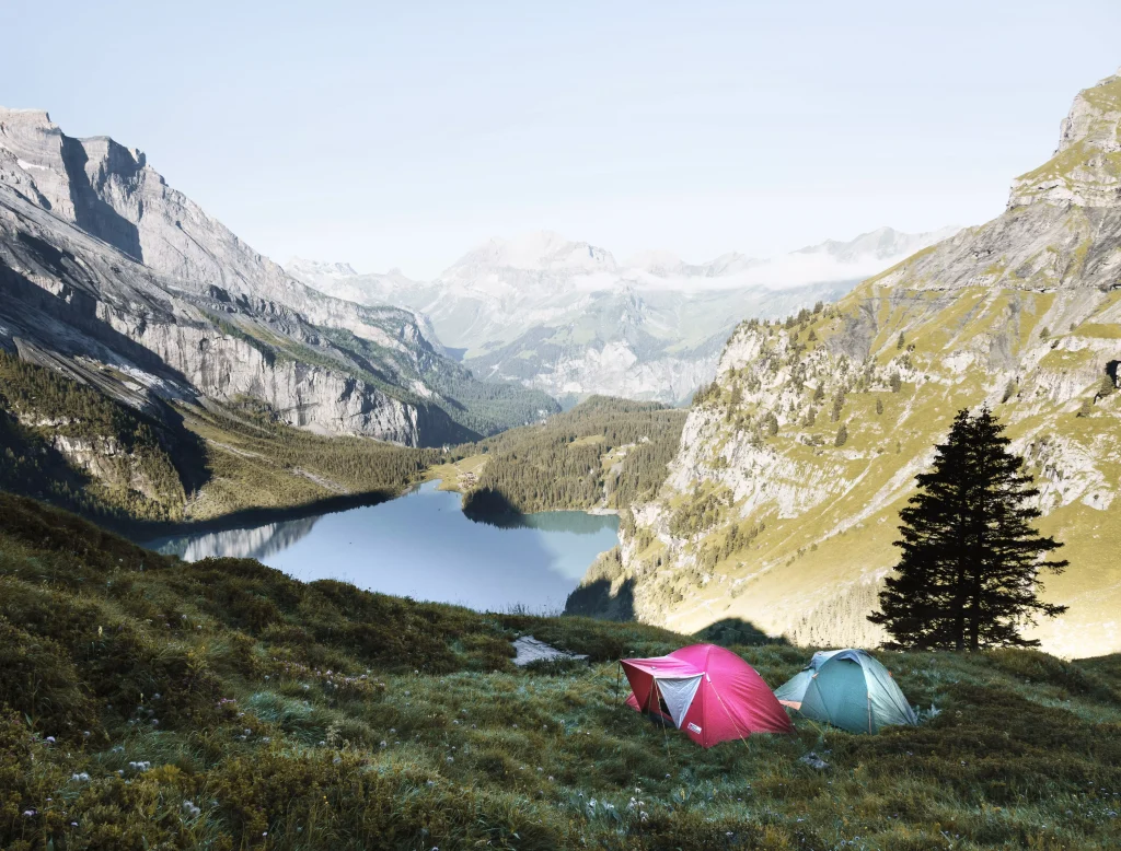 Beautiful view of a lake in the mountains and two tents