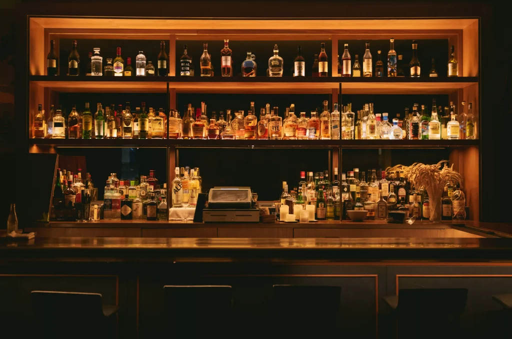 Brown shelf with bottles on it