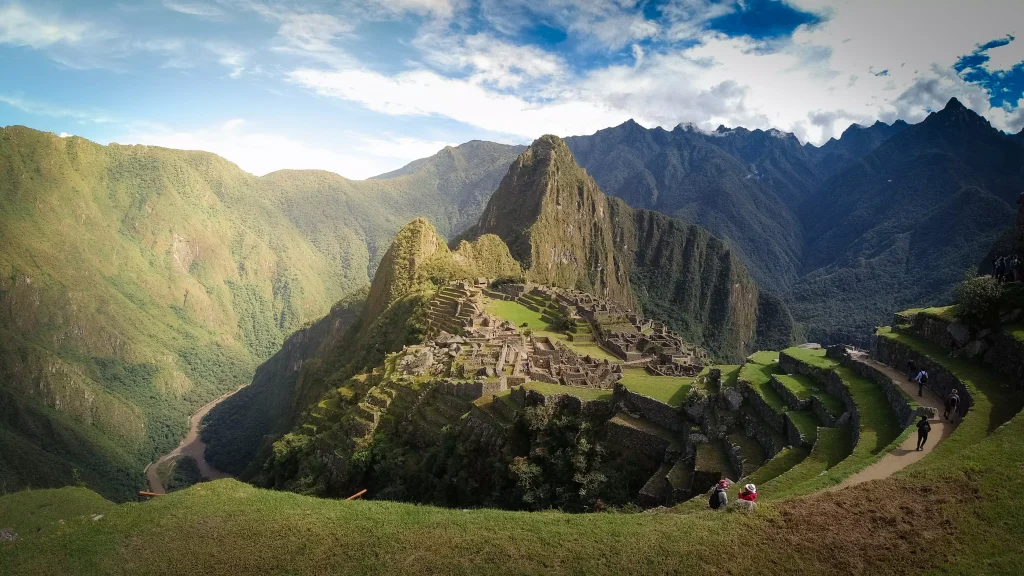 Green fields between mountains