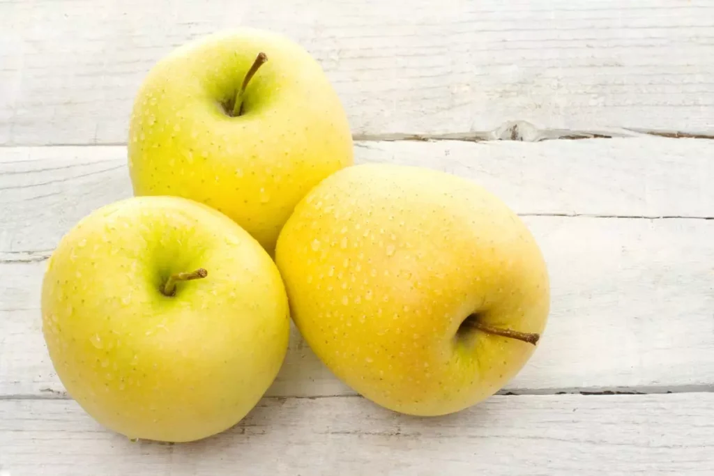 Three yellow apples