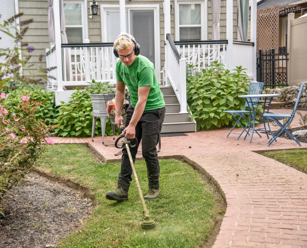 A man triming the grass