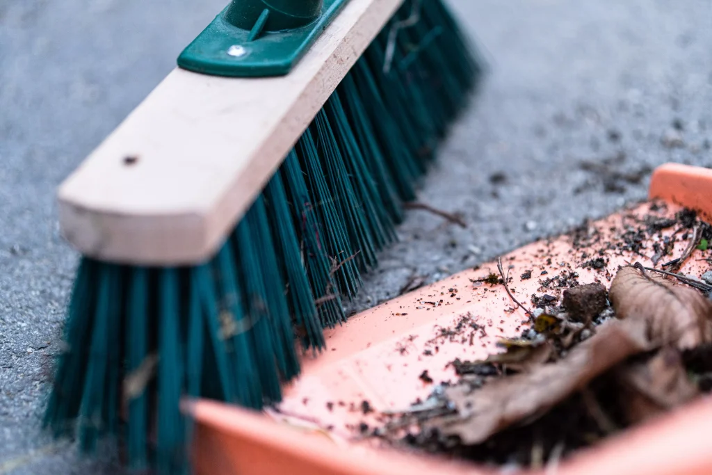 Cleaning dirt with a broom