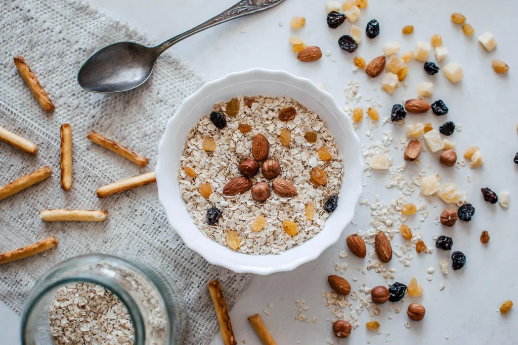 A healthy oatmeal with nuts and milk in a bowl