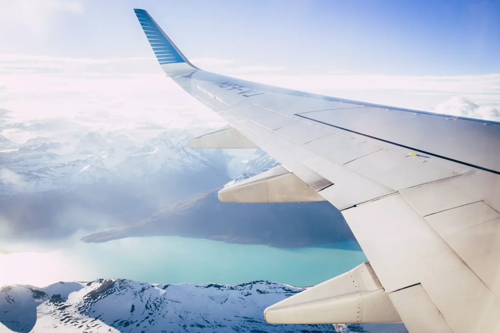 Wing of a plane, seen through the plane window