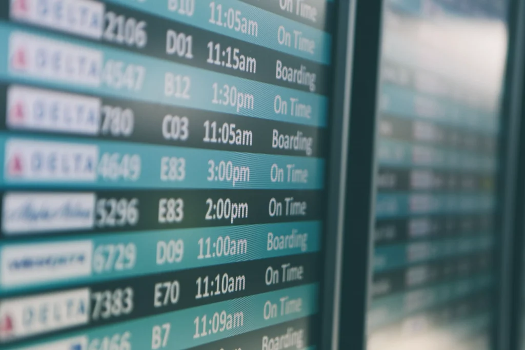 Flights listed on a monitor in airport to diffrent destinations