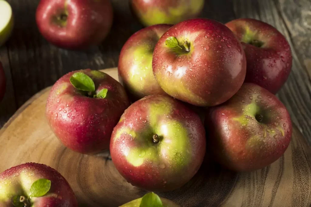 Red green apples on a table