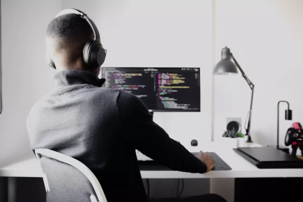 A man with headphones working 