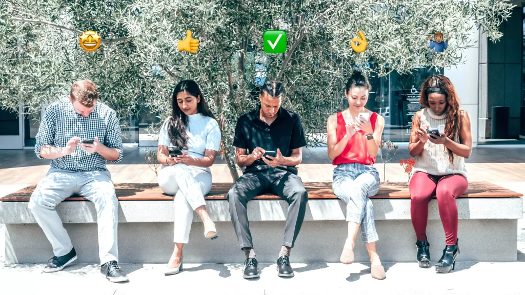 5 diffrent people on their phone with an emoji above their heads