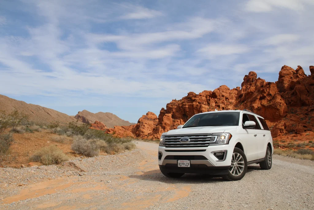 White ford parked in a desert