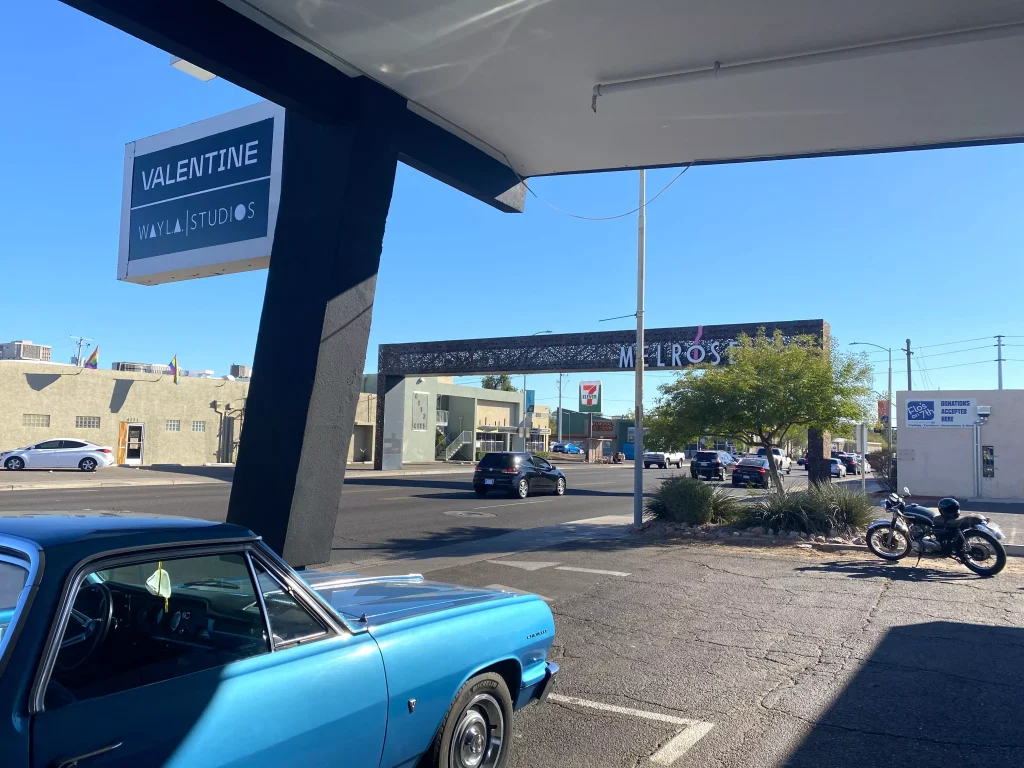 blue car at a gas station