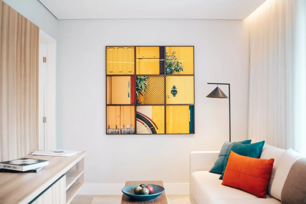 A beautifully designed living room with yellow wall art