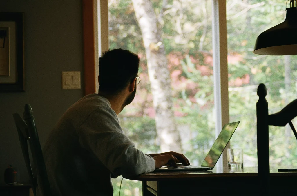 A man enjoying the nature from inside of his home