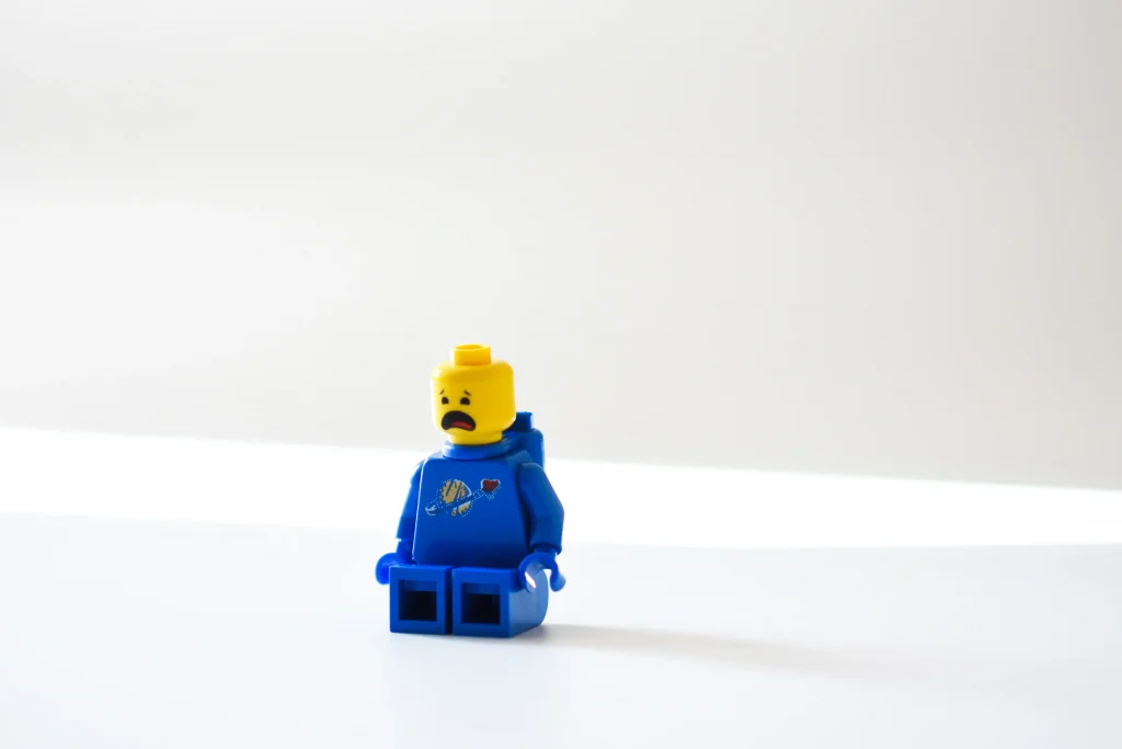 A lego figure in blue with a disapointed face animation