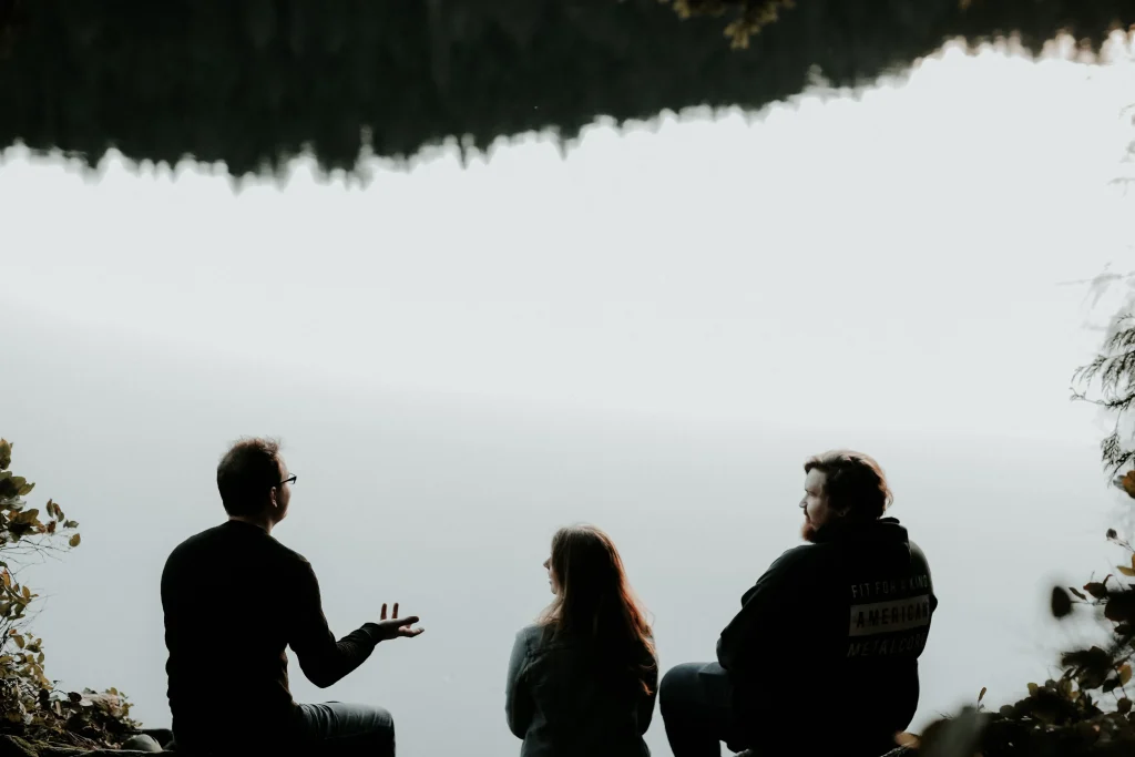 Three people talking