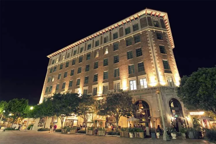 square shape building with lights on it photographed at night