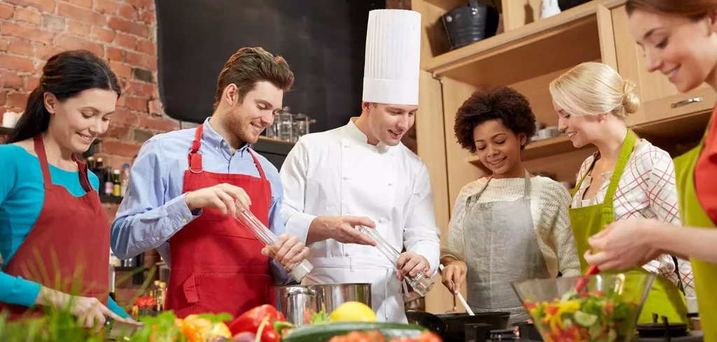 people making some food in the kitchen together