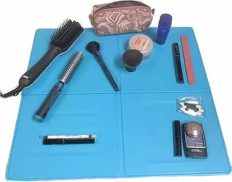 makeup accessories on a blue mat