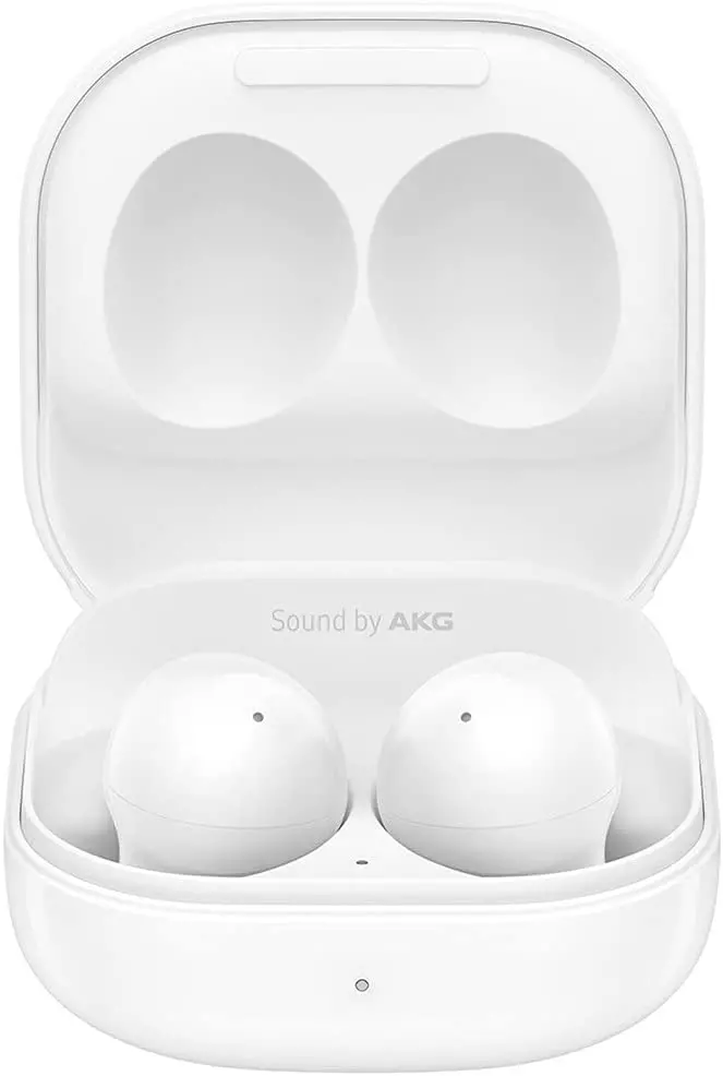 white headphones in a charging box