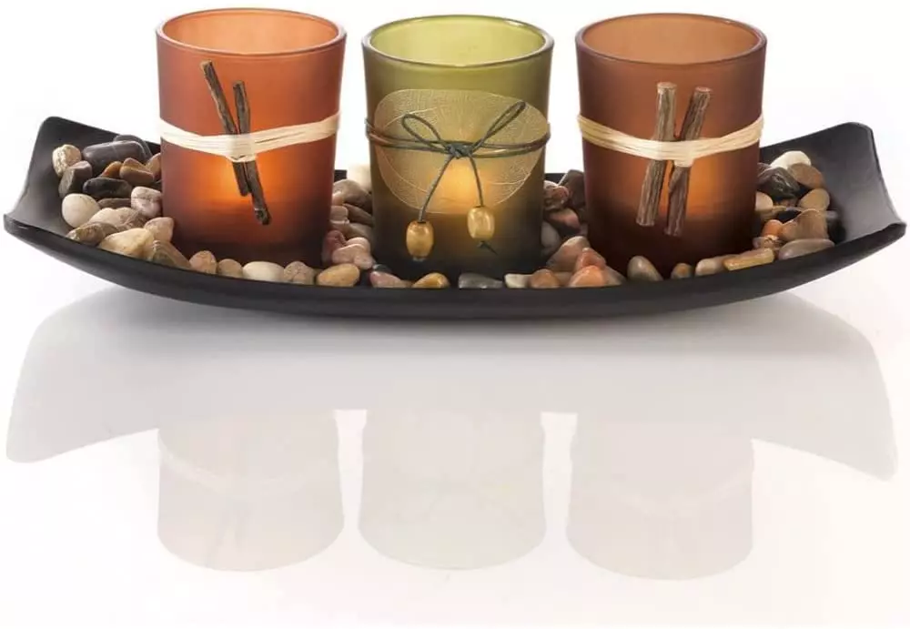 three candles in stones