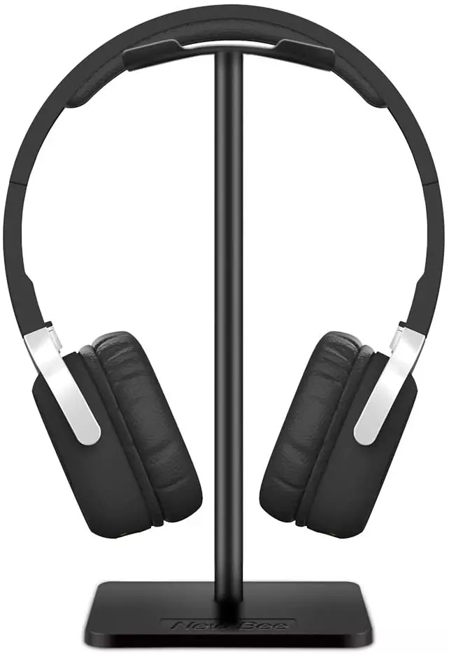 black color headphones on a black color headphone stand