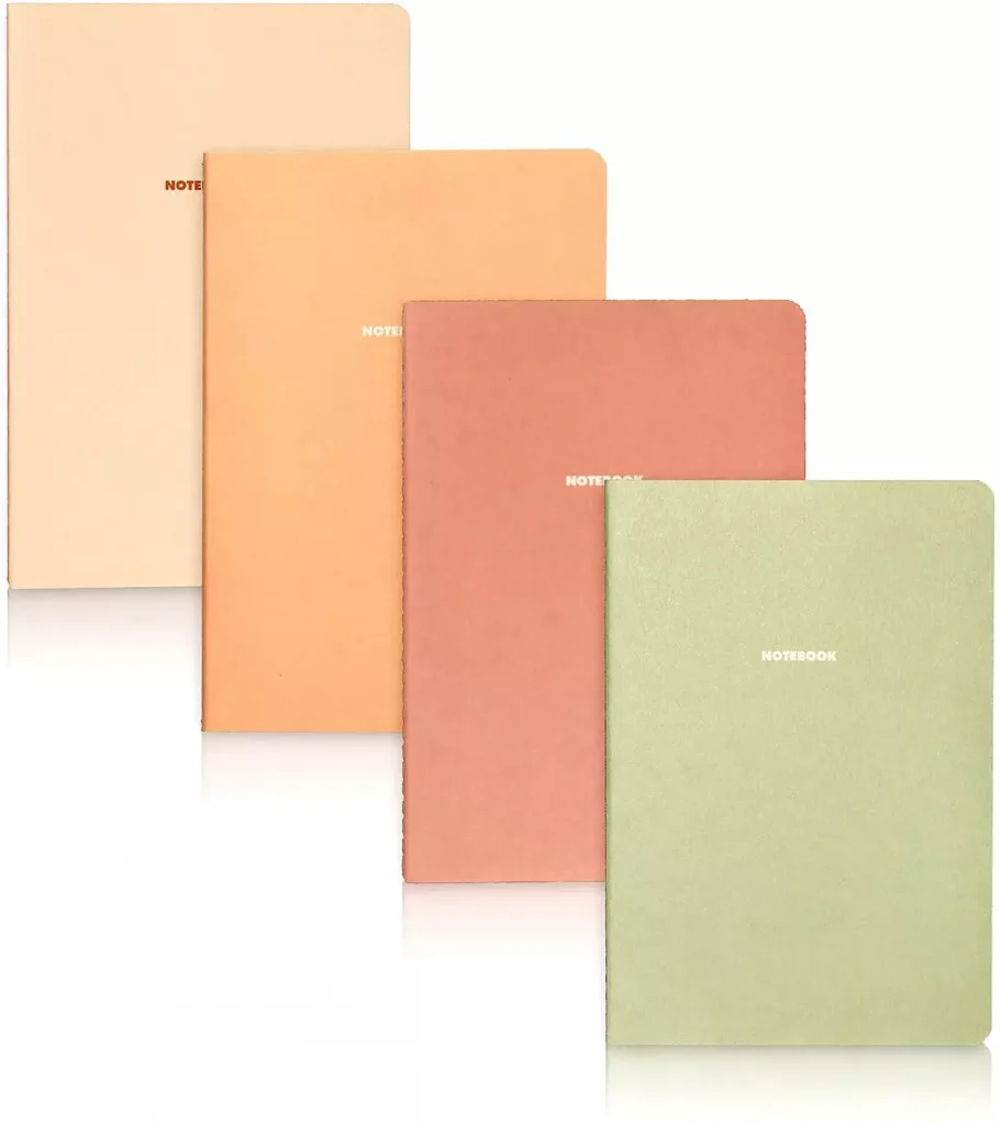 a pink orange red and green notebook