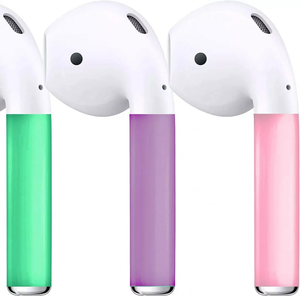 three headphones in colors green violet and pink respectively