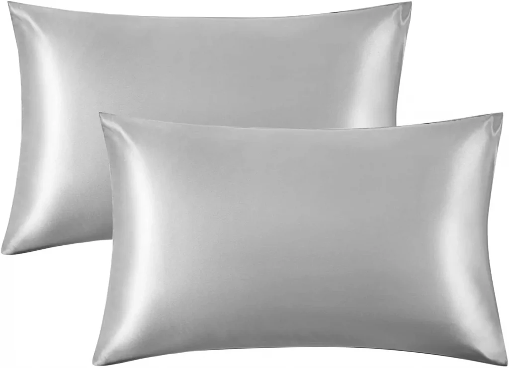 two same sized grey silk pillows