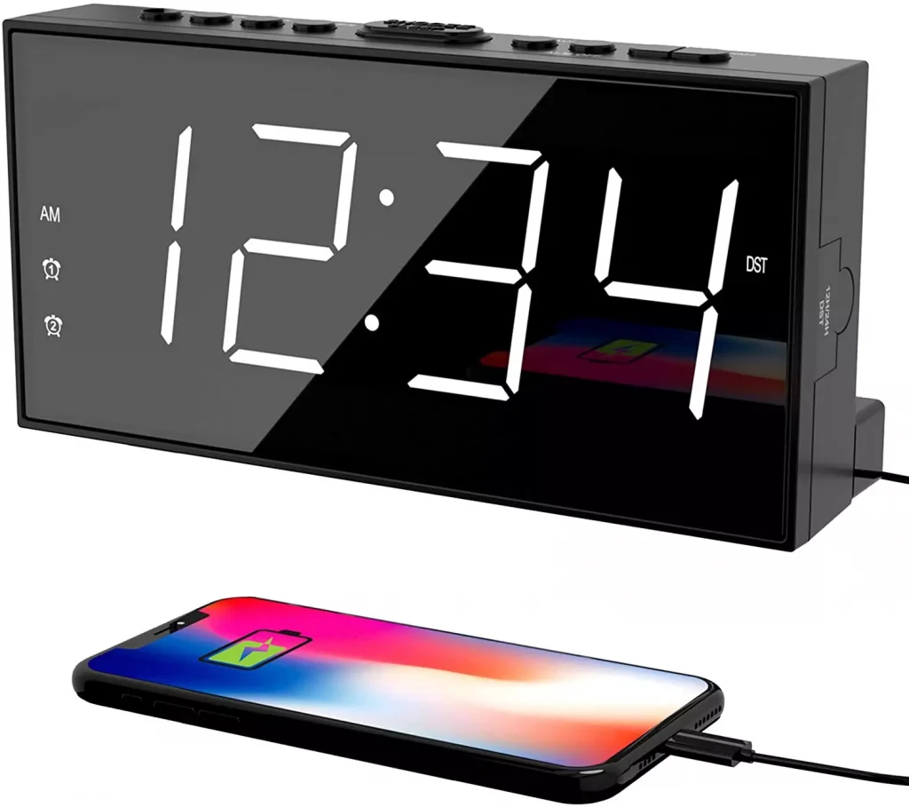 alarm clock next to a mobile phone