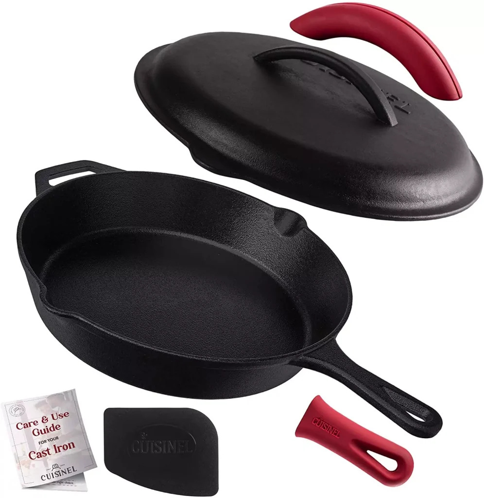 a pan with red details and a handbook for usage next to it