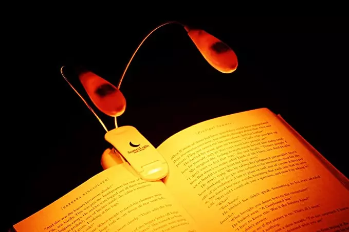 a lamp attached to a book