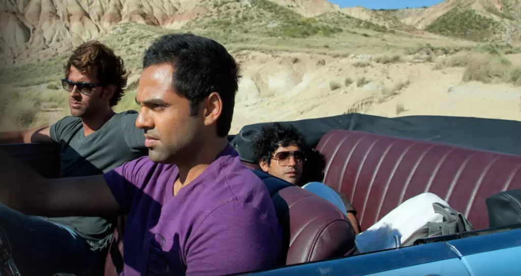 three guys in a cabriolet car