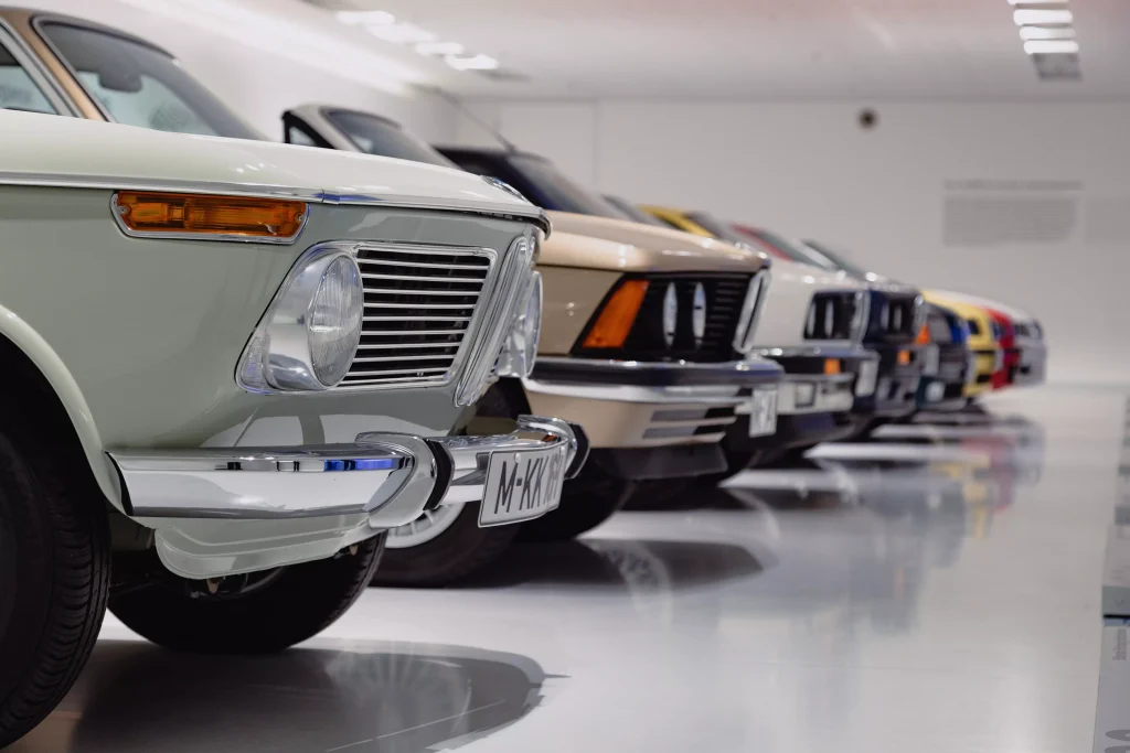 cars parked next to each other in a garage