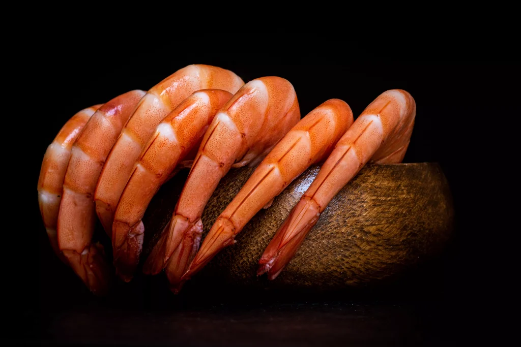 red food in a small wooden bowl