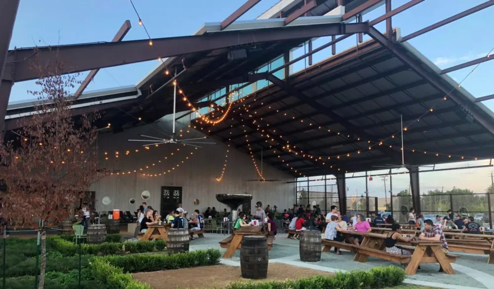 an open roof restaurant with people inside