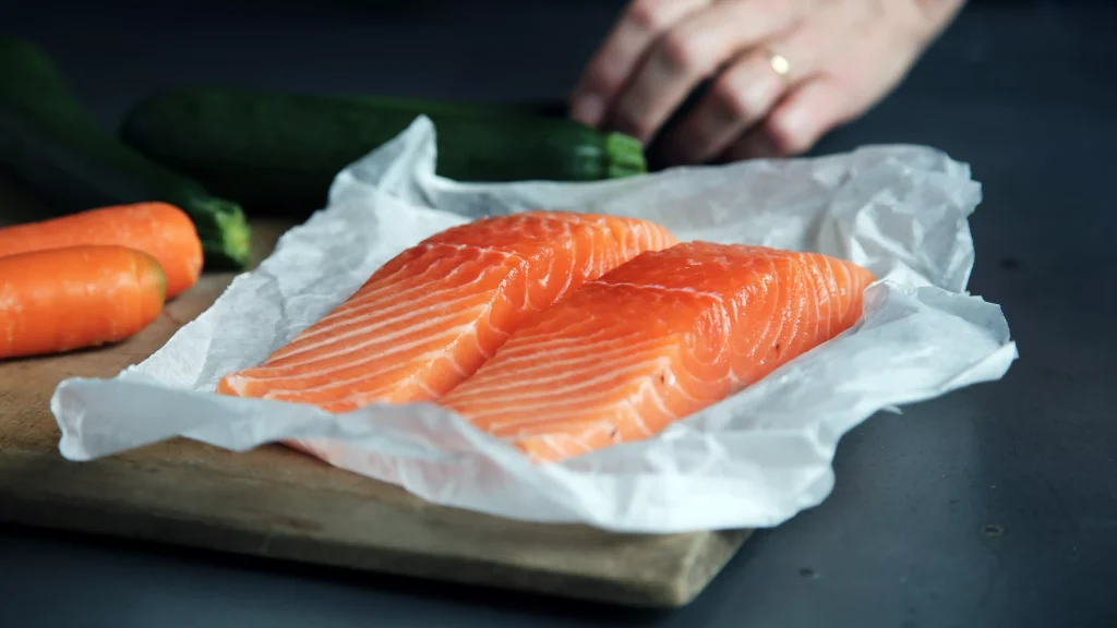 salmon on white paper preparing to be cooked