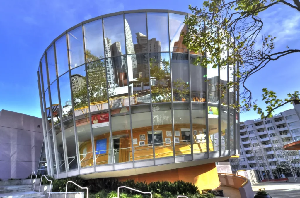 a circle shaped building with a lot of glass