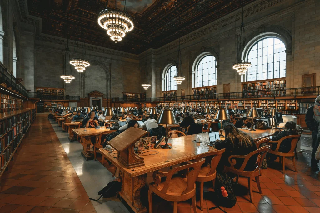 inside of a library where people are quietly reading books