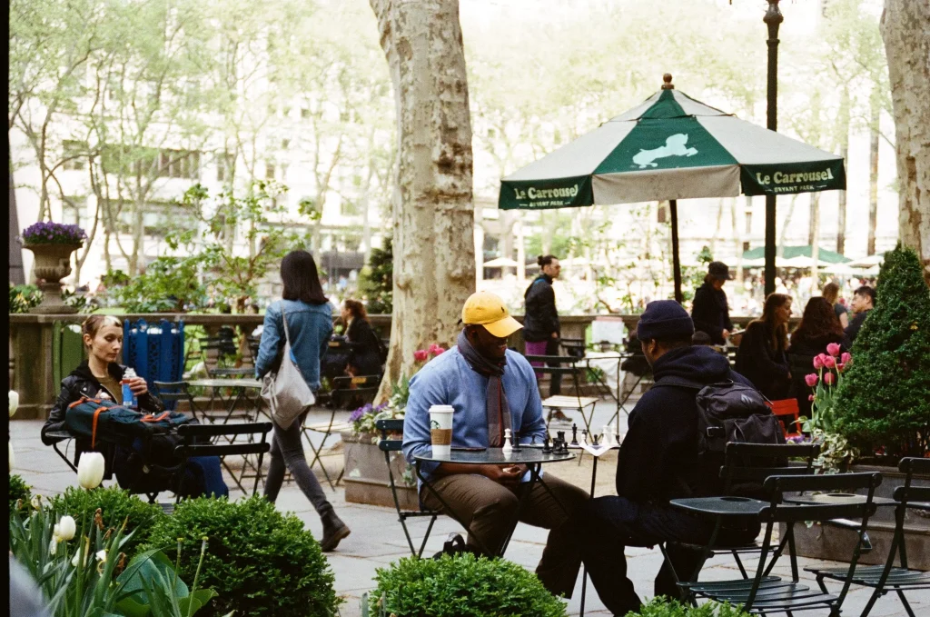 people sitting in a restaurant outside