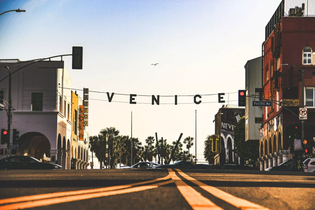 a street and a sign in the street that says venice