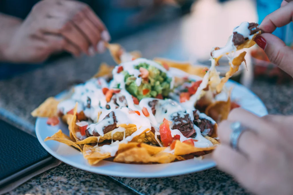 people eating from a plate