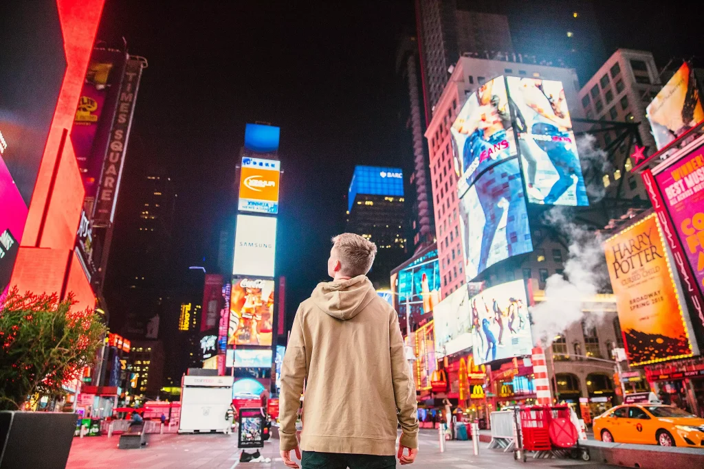 a man between big colorful buildings