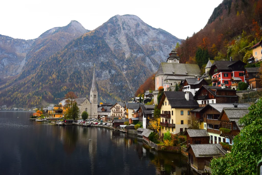 a little village on a lake in a forest