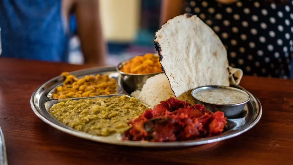 different foods served on a silver plate