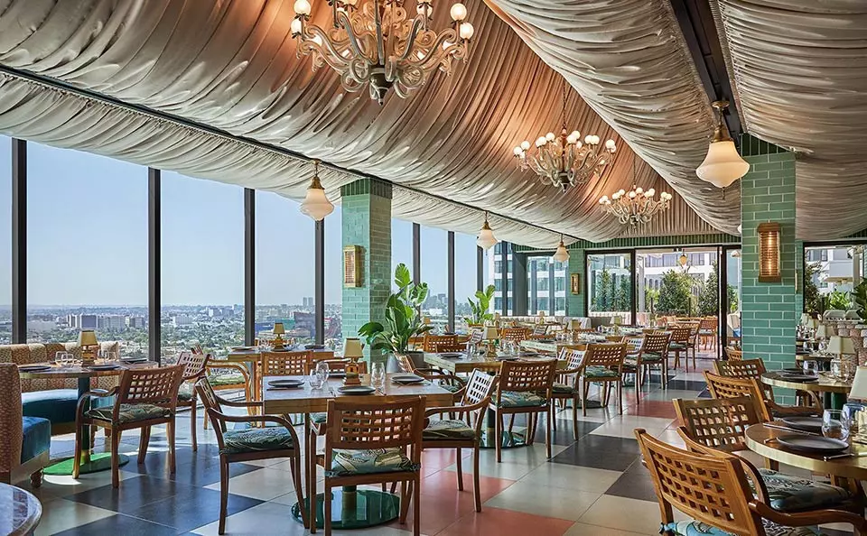 rooftop restaurant with tubic rooftop and wooden chairs