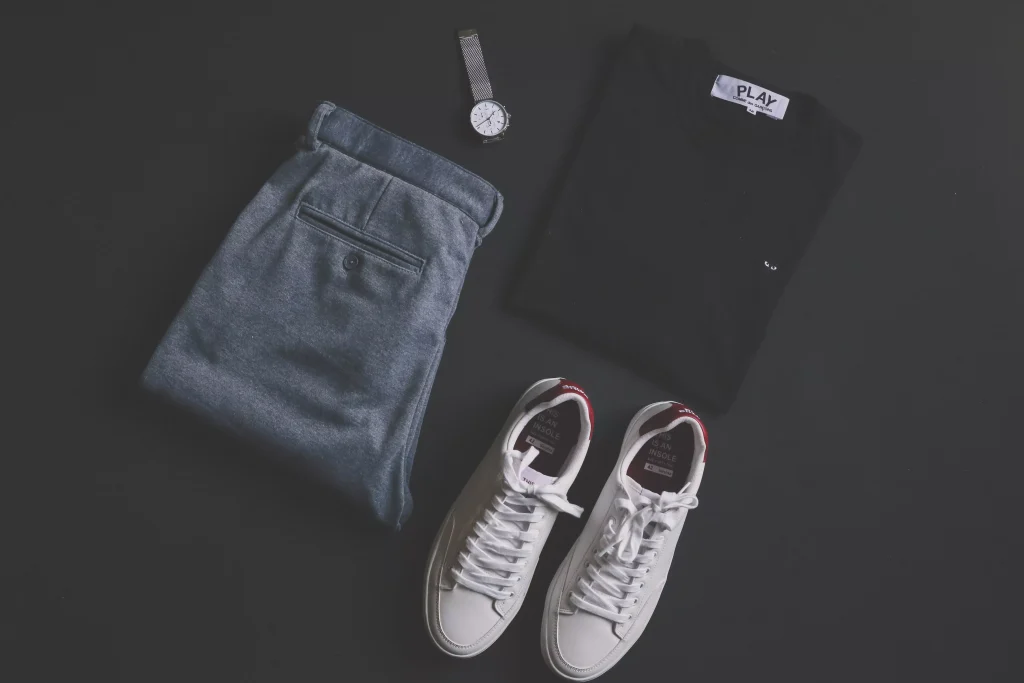 a pair of jeand, shirt, shoes and a watch